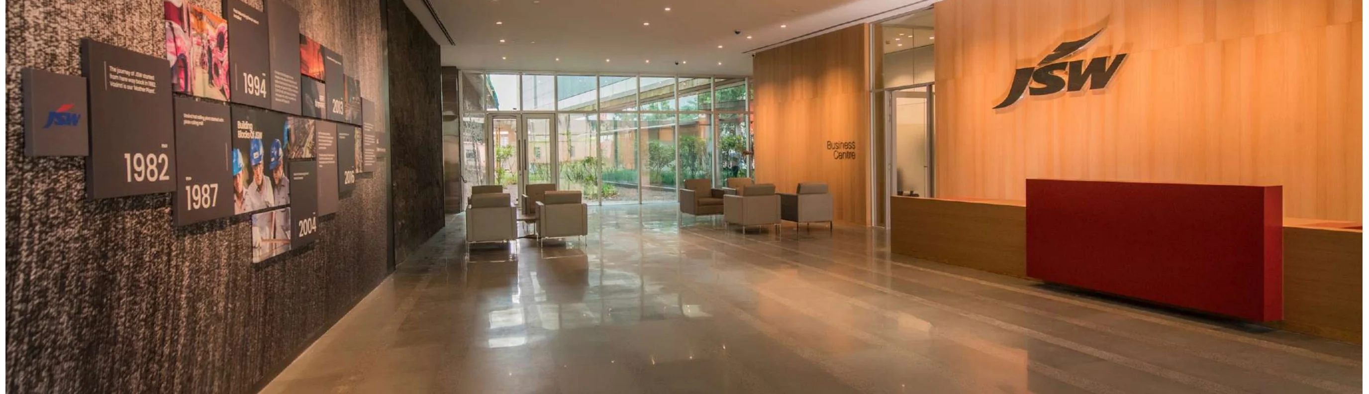 Completed corporate reception with backlit signage and polished concrete floor